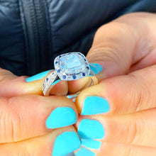 Load image into Gallery viewer, Cushion Cut Moissanite And Round Cut Sides Sapphires Halo Style Engagement Ring And Matching Band Bezel Set In 14k Solid White Gold 2.70ctw