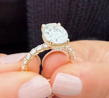 Load image into Gallery viewer, Oval Shape Moissanite And Round Cut Sides Engagement Ring Prong Set In 14k Solid Yellow Gold Wedding Bridal Ring Hidden Halo Style 4.00ctw
