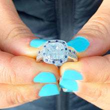 Load image into Gallery viewer, Cushion Cut Moissanite And Round Cut Sides Sapphires Halo Style Engagement Ring And Matching Band Bezel Set In 14k Solid White Gold 2.70ctw
