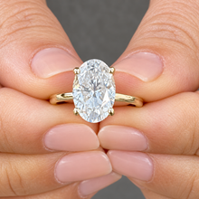 Load image into Gallery viewer, Oval Moissanite &amp; Round Hidden Halo Bridal Ring Set 14K Yellow Gold 3.15 CTW
