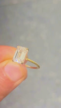 Load and play video in Gallery viewer, Emerald Shape Moissanite Center And Round Cut Sides Engagement Ring Inner Halo Style 14k Yellow Gold Wedding Ring 3.10ctw
